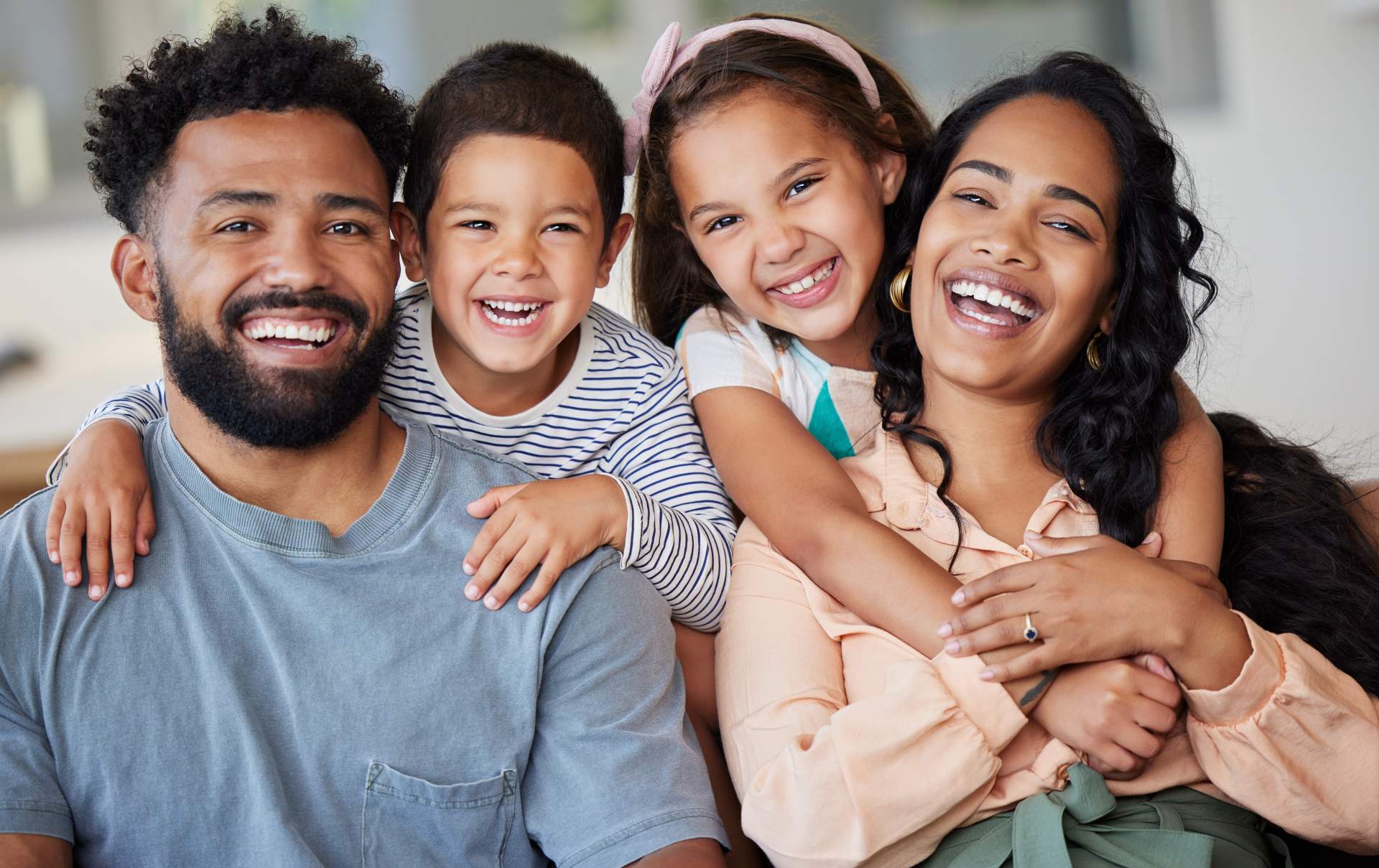 smiling-family-poses-together-in-home-environment-2026-03-25-02-15-11-utc